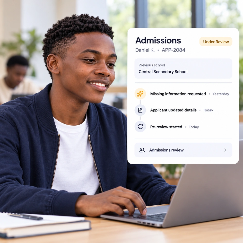 A young applicant uses a laptop as missing information is updated and his application returns to review.
